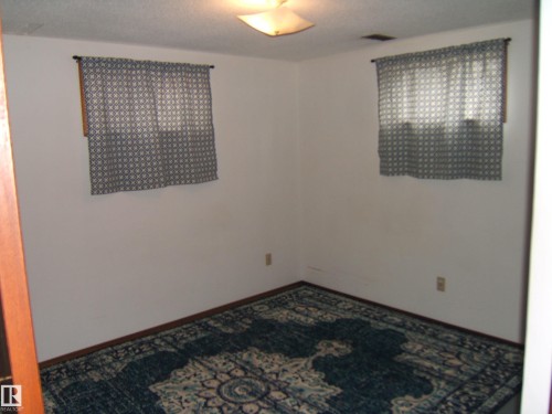 Image quality insufficient for description - 5030 52 Avenue, Andrew, AB - Indoor Photo Showing Other Room