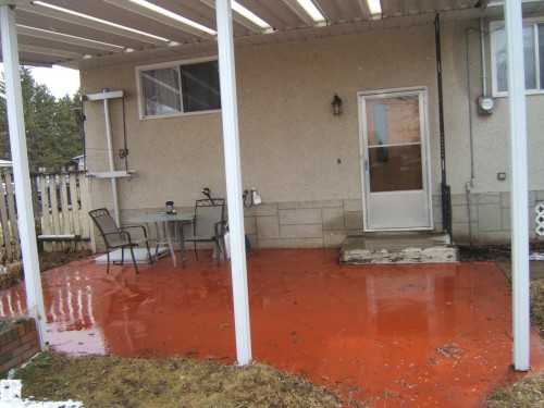 Covered patio area featuring a red-hued concrete surface - 5030 52 Avenue, Andrew, AB -  With Exterior