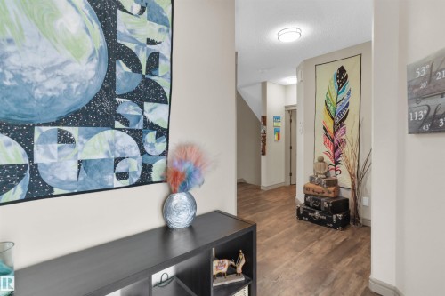 Hallway featuring wood-finish flooring, recessed lighting, and neutral wall tones - 97 Astoria Point(E), Devon, AB - Indoor Photo Showing Other Room