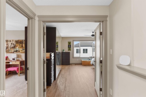 Hallway with light gray wall paint and matching trim - 97 Astoria Point(E), Devon, AB - Indoor Photo Showing Other Room