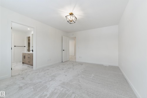 Spacious room with plush light gray carpeting and crisp white walls - 162 Caldeon Crescent, Spruce Grove, AB - Indoor Photo Showing Other Room