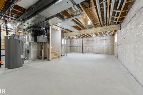 Spacious unfinished basement with concrete flooring and exposed ceiling joists - 162 Caldeon Crescent, Spruce Grove, AB - Indoor Photo Showing Basement