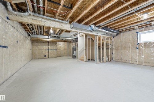 Unfinished basement with concrete flooring and exposed ceiling joists - 162 Caldeon Crescent, Spruce Grove, AB - Indoor Photo Showing Basement