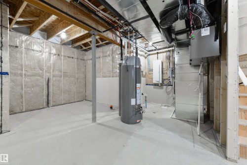 Unfinished basement featuring exposed wood joists, concrete flooring, and insulated perimeter walls - 162 Caldeon Crescent, Spruce Grove, AB - Indoor Photo Showing Basement
