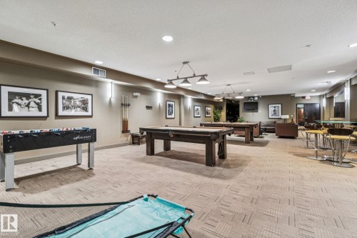 Expansive common area featuring patterned carpeting, recessed lighting, and ample space for various activities - #321 63 Inglewood Park, Calgary, AB - Indoor Photo Showing Other Room