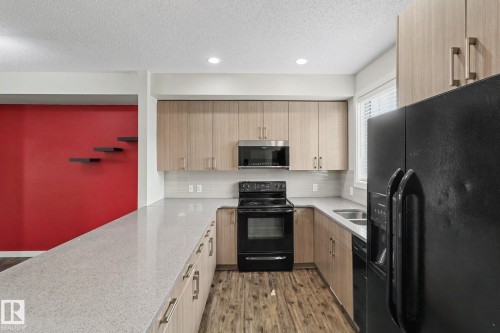 43 2803 James Mowatt Trail, Edmonton, AB - Indoor Photo Showing Kitchen With Double Sink