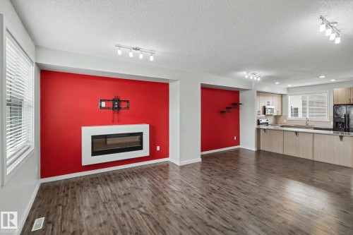 43 2803 James Mowatt Trail, Edmonton, AB - Indoor Photo Showing Living Room With Fireplace