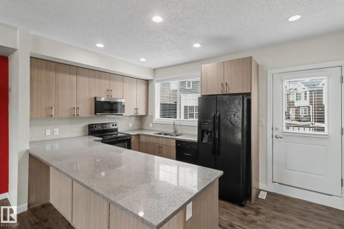 43 2803 James Mowatt Trail, Edmonton, AB - Indoor Photo Showing Kitchen With Double Sink