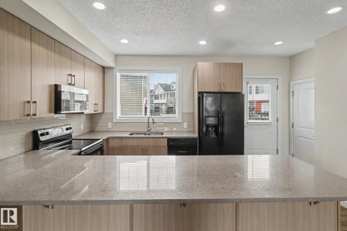 43 2803 James Mowatt Trail, Edmonton, AB - Indoor Photo Showing Kitchen With Double Sink With Upgraded Kitchen