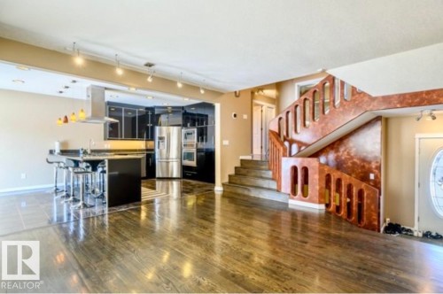 Open-concept living space featuring wood-finish flooring - 18633 122 Avenue, Edmonton, AB - Indoor Photo Showing Kitchen