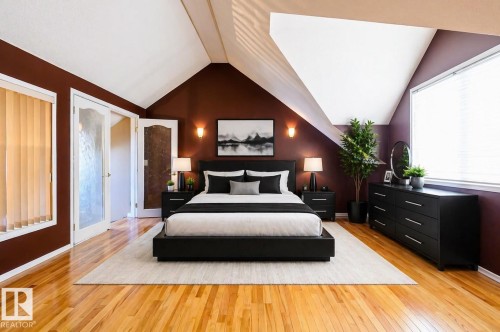 Hardwood flooring throughout, complemented by a vaulted ceiling - 18633 122 Avenue, Edmonton, AB - Indoor Photo Showing Bedroom