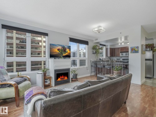 1005 9939 109 Street, Edmonton, AB - Indoor Photo Showing Living Room With Fireplace