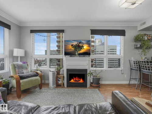 1005 9939 109 Street, Edmonton, AB - Indoor Photo Showing Living Room With Fireplace