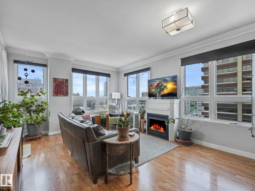 1005 9939 109 Street, Edmonton, AB - Indoor Photo Showing Living Room With Fireplace