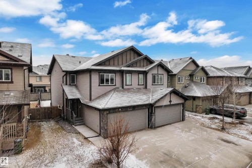 Contemporary two-story residence featuring a multi-gable roofline and attached double garage - 718 177 Street, Edmonton, AB - Outdoor