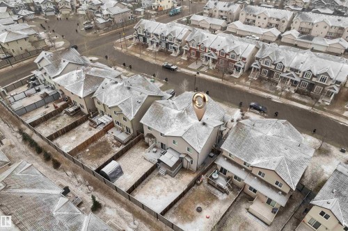 Aerial view of a residential neighborhood featuring detached homes with pitched roofs and private fenced backyards - 718 177 Street, Edmonton, AB - Outdoor