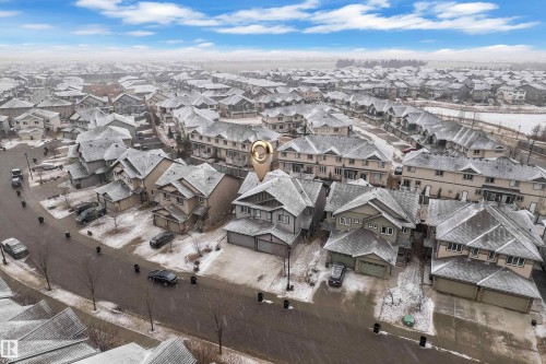 Aerial perspective of a residential street with multiple detached and attached homes - 718 177 Street, Edmonton, AB - Outdoor With View
