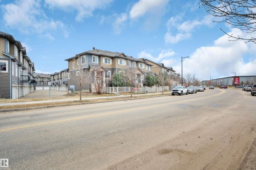 Multi-story townhome with neutral siding and white trim - 13 1030 Chappelle Boulevard, Edmonton, AB - Outdoor