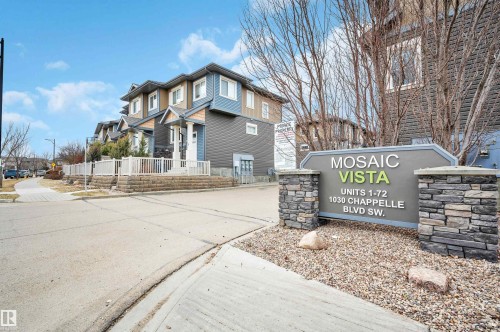 Mosaic Vista community sign featuring stone pillars and a dark grey and green color scheme - 13 1030 Chappelle Boulevard, Edmonton, AB - Outdoor