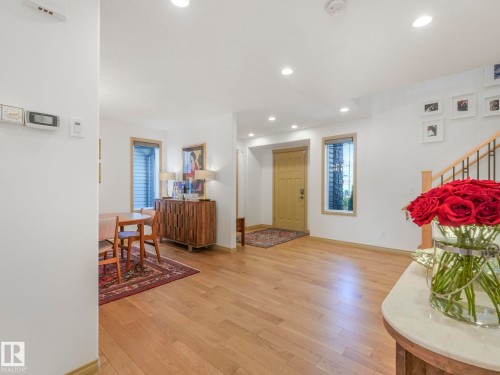 Large Foyer and entryway, features mirror closet with ample storage. This is 1 of 2 closets on the main floor. - 8723 207 Street Nw, Edmonton, AB - Indoor