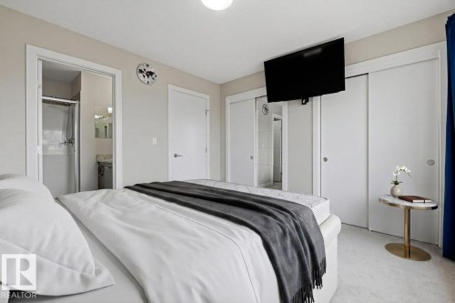 Bedroom featuring soft neutral wall tones and light-colored carpeting - 18, 2560 Pegasus Boulevard, Edmonton, AB - Indoor Photo Showing Bedroom