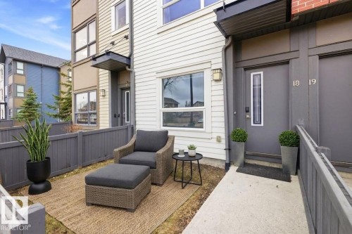 Private outdoor patio space featuring a woven area rug - 18, 2560 Pegasus Boulevard, Edmonton, AB - Outdoor With Exterior