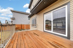 Expansive wood deck with a perimeter railing - 