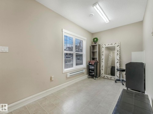 Neutral tone walls complementing light-colored floor tiles - 96 8315 180 Avenue, Edmonton, AB - Indoor
