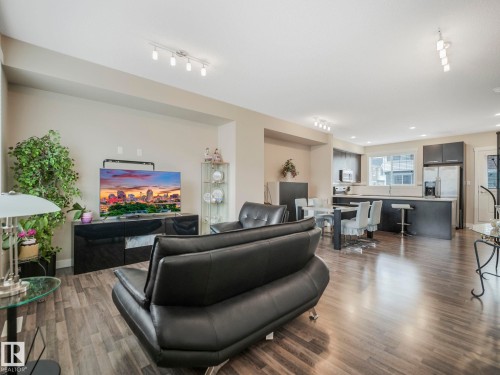 Open-concept living space featuring wood-finish flooring, recessed lighting, and track lighting - 96 8315 180 Avenue, Edmonton, AB - Indoor Photo Showing Living Room