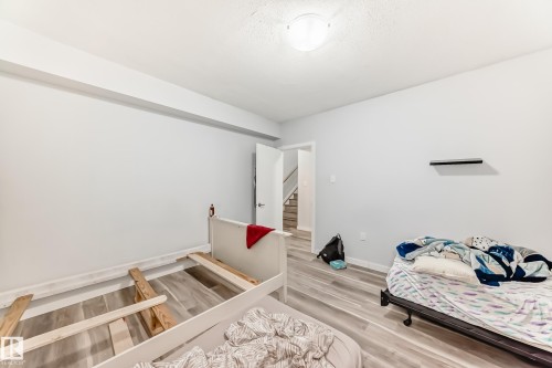 Light-colored walls and wood-finish flooring create a bright ambiance - 69 Caragana Way, Fort Saskatchewan, AB 