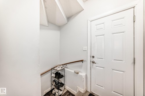 White paneled door with brushed nickel hardware - 69 Caragana Way, Fort Saskatchewan, AB 