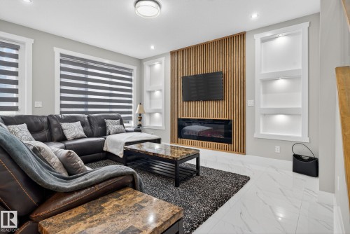 1815 17 Avenue, Edmonton, AB - Indoor Photo Showing Living Room With Fireplace