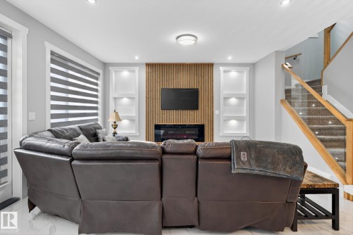 1815 17 Avenue, Edmonton, AB - Indoor Photo Showing Living Room With Fireplace
