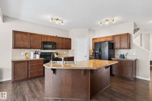 3233 21A Avenue, Edmonton, AB - Indoor Photo Showing Kitchen With Double Sink