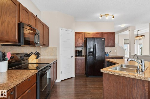 3233 21A Avenue, Edmonton, AB - Indoor Photo Showing Kitchen With Double Sink