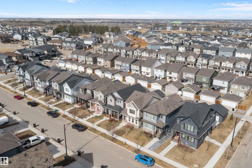 Aerial perspective showcasing a residential street with diverse architectural styles, including two-story homes and bungalows - 4235 Chichak Close, Edmonton, AB - Outdoor With View