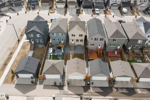Aerial perspective showcasing a collection of modern detached homes with individual garages - 4235 Chichak Close, Edmonton, AB - Outdoor