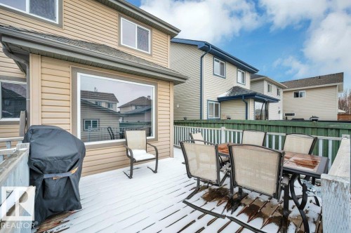 Expansive outdoor deck featuring wood-finish flooring and white perimeter railing - 12063 19 Avenue, Edmonton, AB - Outdoor With Deck Patio Veranda With Exterior