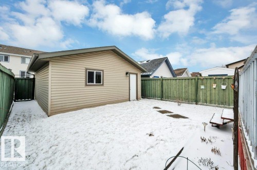 Detached garage with siding exterior and an entry door - 12063 19 Avenue, Edmonton, AB - Outdoor With Exterior