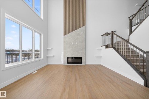 461 Crystal Creek Link, Leduc, AB - Indoor Photo Showing Other Room With Fireplace