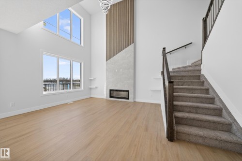 461 Crystal Creek Link, Leduc, AB - Indoor Photo Showing Other Room With Fireplace