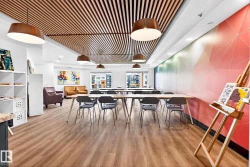 Open concept room featuring wood-finish flooring and a slatted wood ceiling - 520 7463 May Common, Edmonton, AB - Indoor