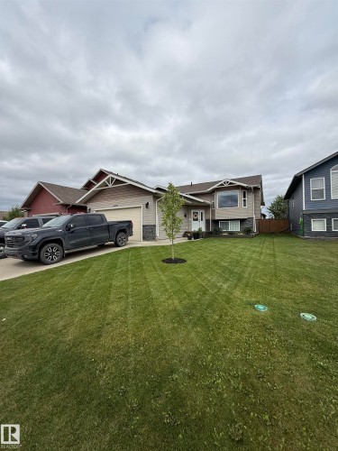 Contemporary two-story residence featuring a combination of siding and stone veneer - 4926 58 Ave, Cold Lake, AB - Outdoor