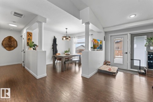 Open-concept living space featuring wood-finish flooring, white walls, and recessed lighting - 4926 58 Ave, Cold Lake, AB - Indoor Photo Showing Other Room