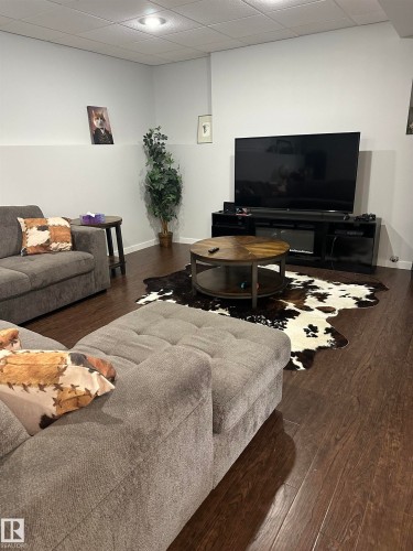 Recessed lighting illuminates the space, featuring rich wood-finish flooring - 4926 58 Ave, Cold Lake, AB - Indoor