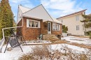 Brick exterior residence with white siding accents and a metal roof - 7703 77 Avenue, Edmonton, AB 