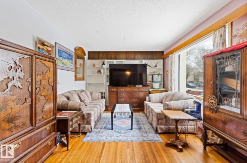 Hardwood flooring throughout the living space - 7703 77 Avenue, Edmonton, AB 