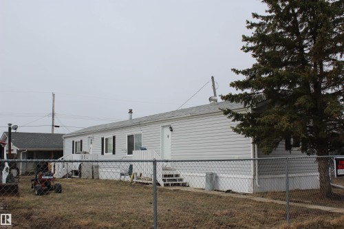 Single-story residence featuring white siding and a light-colored roof - 4839 49 Avenue, Chipman, AB - Outdoor With Exterior