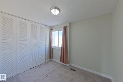 This room features light grey walls and a grey carpet - 184 Cornell Court, Edmonton, AB - Indoor Photo Showing Other Room