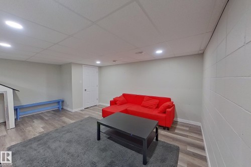 Spacious room featuring light-colored walls, recessed lighting, and durable flooring, offering versatile usage - 184 Cornell Court, Edmonton, AB - Indoor